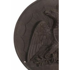 AMERICAN, PRE-CIVIL WAR, CAST IRON MEDALLION / PLAQUE WITH A FEDERAL EAGLE SUPERIMPOSED ON A SUNBURST, DATED 1857