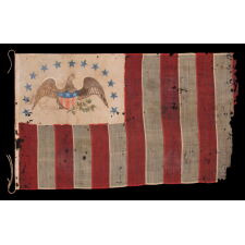 ONE OF THE TWO EARLIEST KNOWN EXAMPLES OF THE FLAG OF THE REVENUE MARINE (a.k.a., REVENUE CUTTER SERVICE), WITH A HAND-PAINTED EAGLE, AN ARCH OF 13 BLUE-PAINTED STARS, HAVING GREAT FOLK QUALITIES, AND 13 VERTICAL STRIPES, LATE 1830’s-1860