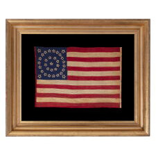 EXTRAORDINARY, HOMEMADE, 33 STAR ANTIQUE AMERICAN PARADE FLAG, AMONG ITS COUNTERPARTS, MADE OF SILK AND EXPERTLY HAND-SEWN THROUGHOUT, WITH UNUSUAL EMBROIDERED STARS IN A DOUBLE WREATH STYLE MEDALLION; LIKELY MADE FOR THE PRESIDENTIAL CAMPAIGN IN WHICH LINCOLN WON THE WHITE HOUSE; REFLECTS THE ADDITION OF OREGON IN 1859, OFFICIAL FROM THAT YEAR UNTIL 1861, PRE-CIVIL WAR THROUGH THE WAR’S OPENING YEAR