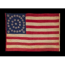 EXTRAORDINARY, HOMEMADE, 33 STAR ANTIQUE AMERICAN PARADE FLAG, AMONG ITS COUNTERPARTS, MADE OF SILK AND EXPERTLY HAND-SEWN THROUGHOUT, WITH UNUSUAL EMBROIDERED STARS IN A DOUBLE WREATH STYLE MEDALLION; LIKELY MADE FOR THE PRESIDENTIAL CAMPAIGN IN WHICH LINCOLN WON THE WHITE HOUSE; REFLECTS THE ADDITION OF OREGON IN 1859, OFFICIAL FROM THAT YEAR UNTIL 1861, PRE-CIVIL WAR THROUGH THE WAR’S OPENING YEAR