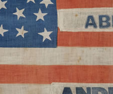 1864 LINCOLN & JOHNSON PRESIDENTIAL CAMPAIGN PARADE FLAG, RECYCLED FROM AN 1860 JOHN BELL, CONSTITUTIONAL UNION PARTY FLAG, WITH 35 STARS ARRANGED IN A UNIQUE VARIANT OF A "PENTAGON" OR "HEART" MEDALLION