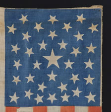 1864 LINCOLN & JOHNSON PRESIDENTIAL CAMPAIGN PARADE FLAG, RECYCLED FROM AN 1860 JOHN BELL, CONSTITUTIONAL UNION PARTY FLAG, WITH 35 STARS ARRANGED IN A UNIQUE VARIANT OF A "PENTAGON" OR "HEART" MEDALLION