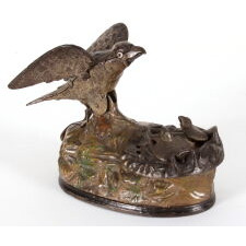 PAINTED, MECHANICAL, CAST IRON BANK WITH AN EAGLE FEEDING EAGLETS, MADE BY STEVENS, circa 1883