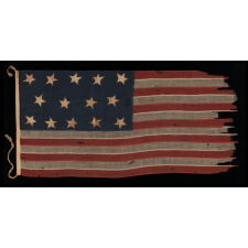 EXTREMELY RARE 14-STAR, 13-STRIPE FLAG, LIKELY MADE DURING THE ANTEBELLUM WITH AN ABOLITIONIST MESSAGE, ENTIRELY HAND-SEWN AND WITH ENDEARING WEAR FROM OBVIOUS USE, POSSIBLY OF U.S. NAVY ORIGIN, circa 1846-1848; EXHIBITED AT THE MUSEUM OF THE AMERICAN REVOLUTION FROM JUNE – SEPTEMBER, 2021