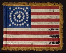 RARE AND BEAUTIFUL 38 STAR FLAG, AN INDIAN WARS PERIOD FLANK GUIDON OF THE 4th U.S. INFANTRY, WITH A MEDALLION CONFIGURATION SURROUNDING THE NUMERAL "4".  1876-1889, COLORADO STATEHOOD