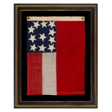 VERY RARE CONFEDERATE NAVAL ENSIGN IN THE FIRST NATIONAL (STARS & BARS) PATTERN, IN AN EXTRAORDINARY, SMALL SIZE, WITH 11 WHIMSICAL, SINGLE-APPLIQUÉD STARS AND A CURIOUSLY WIDE RED BAR, ENTIRELY HAND-SEWN, MADE BETWEEN MAY - NOVEMBER OF 1861:
