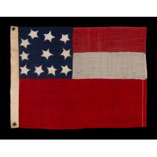 VERY RARE CONFEDERATE NAVAL ENSIGN IN THE FIRST NATIONAL (STARS & BARS) PATTERN, IN AN EXTRAORDINARY, SMALL SIZE, WITH 11 WHIMSICAL, SINGLE-APPLIQUÉD STARS AND A CURIOUSLY WIDE RED BAR, ENTIRELY HAND-SEWN, MADE BETWEEN MAY - NOVEMBER OF 1861: