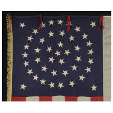 RARE AND EXCEPTIONAL 44 STAR UNITED STATES INFANTRY BATTLE FLAG WITH A MEDALLION CONFIGURATION, GOLD FRINGE, AND RED WOOL TIES, LATE INDIAN WARS, WYOMING STATEHOOD, 1890-1896