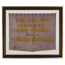 RARE VIOLET & YELLOW SUFFRAGETTE PARADE BANNER WITH PAINTED TEXT THAT READS: “ONE MILLION ORGANIZED CLUB WOMEN ENDORSE, WOMANS SUFFRAGE.” MADE circa 1910-1920, THIS IS THE PLATE EXAMPLE FROM THE BEST PICTORIAL REFERENCE ON SUFFRAGE COLLECTING