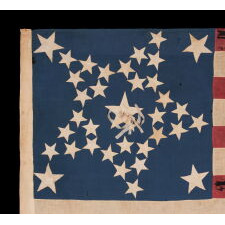 35 STARS IN A DYNAMIC “GREAT STAR” PATTERN, WITH A HUGE CENTER STAR THAT HAS AN UNUSUAL RIBBON ROSETTE, AND LARGE STARS FLANKING IN EACH CORNER, ON A CIVIL WAR PERIOD FLAG, HANDED DOWN THROUGH THE FAMILY OF LT. JOHN POLLOCK (KILLED AT THE BATTLE OF FAIR OAKS, VIRGINIA), SAID TO HAVE BEEN CARRIED BY COMPANY “A” OF THE 61ST PENNSYLVANIA VOLUNTEERS; THIS REGIMENT LOST MORE OFFICERS THAN ANY OTHER IN FEDERAL SERVICE