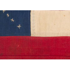 EXTRAORDINARY CONFEDERATE BIBLE FLAG IN THE FIRST NATIONAL FORMAT, MADE OF SILK RIBBON, WITH 14 EMBROIDERED STARS ARRANGED IN THE FORM OF A CANTED CHRISTIAN CROSS; ONE OF JUST THREE KNOWN EXAMPLES WITH A VARIANT OF THIS MAGNIFICENT STAR FORMATION