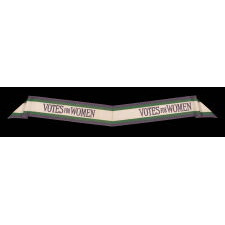 FULL, WRAP-AROUND, SILK SUFFRAGETTE SASH IN GREEN, WHITE, & VIOLET, WITH "VOTES FOR WOMEN" TEXT, DESIGNED BY SYLVIA PANKHURST FOR THE WOMEN’S SOCIAL & POLITICAL UNION (U.K.), LIKELY PRODUCED BY TOYE &. COMPANY OF BIRMINGHAM, circa 1908 AND LIKELY SOLD BY AN AMERICAN-OWNED DEPARTMENT STORE IN THAT SAME CITY, GIFTED TO A BIRMINGHAM ACTIVIST & EDUCATOR