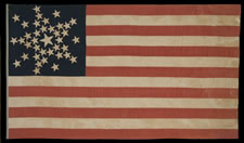 SPECTACULAR 38 STAR FLAG WITH A VERY RARE VARIATION OF THE "GREAT STAR" CONFIGURATION THAT HAS ADDITIONAL STARS BETWEEN EACH ARM, COLORADO STATEHOOD, 1876-1889