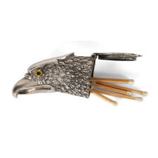 STERLING SILVER MATCH HOLDER IN THE FORM OF AN EAGLE’S HEAD, WITH BEAUTIFUL FORM AND INLAID, GLASS EYES, BRITISH, CIRCA 1900-1940