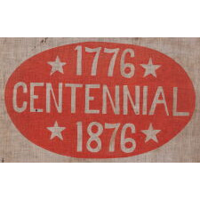 SWALLOW-TAILED PARADE FLAG / PENNANT WITH “1776 CENTENNIAL 1876” SET WITHIN A SUNBURNT, RED-ORANGE, EGG-SHAPED WINDOW, WITHIN A BLUE BORDER WITH 37 STARS; AN EXTREMELY RARE EXAMPLE, MADE TO CELEBRATE THE 100-YEAR ANNIVERSARY OF AMERICAN INDEPENDENCE