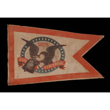 SWALLOW-TAILED PARADE FLAG PENNANT / BANNER, WITH A BOLD ILLUSTRATION OF AN EAGLE CARRYING THE LIBERTY BELL, MADE TO CELEBRATE THE 1876 CENTENNIAL OF AMERICAN INDEPENDENCE; THE ONLY KNOWN EXAMPLE OF ITS KIND