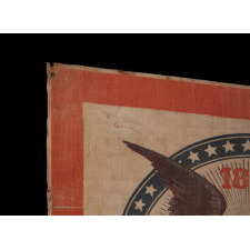 SWALLOW-TAILED PARADE FLAG PENNANT / BANNER, WITH A BOLD ILLUSTRATION OF AN EAGLE CARRYING THE LIBERTY BELL, MADE TO CELEBRATE THE 1876 CENTENNIAL OF AMERICAN INDEPENDENCE; THE ONLY KNOWN EXAMPLE OF ITS KIND