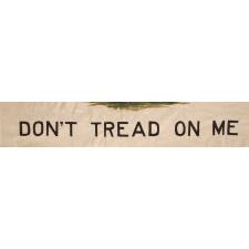 ONE OF A TINY GROUP OF SURVIVING ANTIQUE AMERICAN FLAGS THAT INCLUDES A RATTLESNAKE, IN A VARIANT OF CLOSELY RELATED DESIGNS FLOWN BY THE COLONIAL MASSACHUSETTS NAVY (1775-1776) & POSSIBLY BY THE PENNSYLVANIA NAVY ON THE DELAWARE RIVER (1775 – 1778), ALL WITH A GREEN PINE TREE AS THE CENTRAL DEVICE ON A WHITE FIELD; THIS EXAMPLE MADE circa 1910-1926, WITH A RATTLESNAKE COILED ABOUT ITS BASE AND TWO SLOGANS: “AN APPEAL TO GOD” & “DON’T TREAD ON ME”