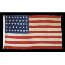 UNUSUAL ANTIQUE AMERICAN FLAG WITH 38 STARS ON A PAINT-PRINTED CANTON, ADJOINED TO 13 PIECED-AND-SEWN STRIPES, 1876-1889, COLORADO STATEHOOD