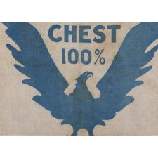 WWI BOND DRIVE FLAG WITH A WHIMSICAL & ARTISTICALLY COMPELLING EAGLE, PERCHED DIRECTLY ON THE LOWER EDGE OF THE TEXTILE, WITH WINGS UPSTRETCHED IN A “V” FOR “VICTORY,” CRADLING THE SLOGAN: “VICTORY CHEST 100%;” PRUSSIAN BLUE ON A WHITE GROUND; LIKELY MADE FOR THE 5th BOND SUBSCRIPTION, ISSUED MAY 20th, 1919