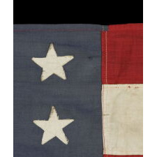 48 STAR AMERICAN NATIONAL FLAG WITH ITS CANTON RESTING ON THE WAR STRIPE, POSSIBLY MADE IN FRANCE DURING WWII TO WELCOME U.S. TROOPS IN THE WAKE OF LIBERATION FROM THE NAZIS, WITH VERBAL HISTORY TO NORMANDY
