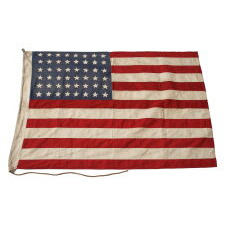48 STAR AMERICAN NATIONAL FLAG WITH ITS CANTON RESTING ON THE WAR STRIPE, POSSIBLY MADE IN FRANCE DURING WWII TO WELCOME U.S. TROOPS IN THE WAKE OF LIBERATION FROM THE NAZIS, WITH VERBAL HISTORY TO NORMANDY