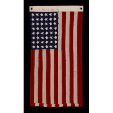 48 STAR, U.S. NAVY SMALL BOAT ENSIGN, MADE AT MARE ISLAND, CALIFORNIA DURING WWII, SIGNED AND DATED 1944, IN THE SMALLEST SCALE EMPLOYED AT THE TIME