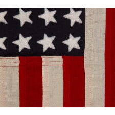 48 STAR, U.S. NAVY SMALL BOAT ENSIGN, MADE AT MARE ISLAND, CALIFORNIA DURING WWII, SIGNED AND DATED 1944, IN THE SMALLEST SCALE EMPLOYED AT THE TIME
