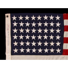 48 STAR U.S. NAVY SMALL BOAT ENSIGN OF THE WWII ERA (U.S. INVOLVEMENT 1941-45), MADE BY DETTRA IN PENNSYLVANIA, WITH A RARE “VALLEY FORGE” NAME BRAND