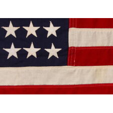 48 STAR U.S. NAVY SMALL BOAT ENSIGN OF THE WWII ERA (U.S. INVOLVEMENT 1941-45), MADE BY DETTRA IN PENNSYLVANIA, WITH A RARE “VALLEY FORGE” NAME BRAND