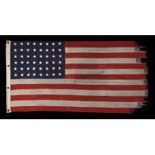 WWII VINTAGE ANTIQUE AMERICAN FLAG WITH 48 STARS AND ENDEARING WEAR FROM OBVIOUS LONG-TERM USE, A U.S. NAVY SMALL BOAT ENSIGN MARKED "No. 11"