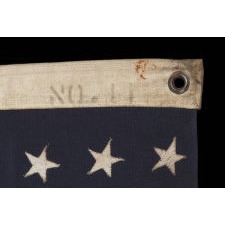 WWII VINTAGE ANTIQUE AMERICAN FLAG WITH 48 STARS AND ENDEARING WEAR FROM OBVIOUS LONG-TERM USE, A U.S. NAVY SMALL BOAT ENSIGN MARKED "No. 11"
