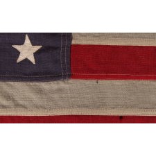 WWII VINTAGE ANTIQUE AMERICAN FLAG WITH 48 STARS AND ENDEARING WEAR FROM OBVIOUS LONG-TERM USE, A U.S. NAVY SMALL BOAT ENSIGN, MARKED "No. 11, DATED “1943,” MADE AT MARE ISLAND, CALIFORNIA, HEADQUARTERS OF THE PACIFIC FLEET